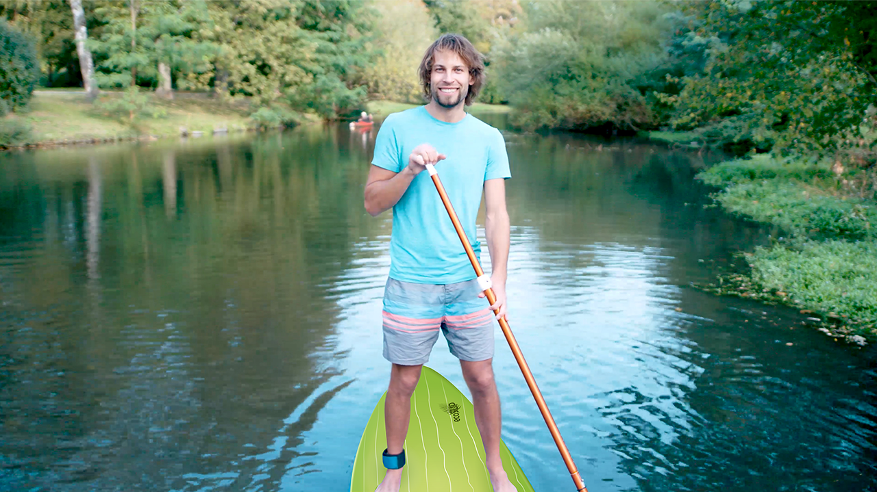 Christoph Pöhler standing on a stand-up paddleboard on the Oker river.