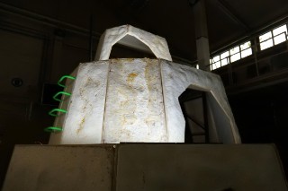 The photo shows the mountain landscape made of mycelium plates. On the side there is a stepladder.