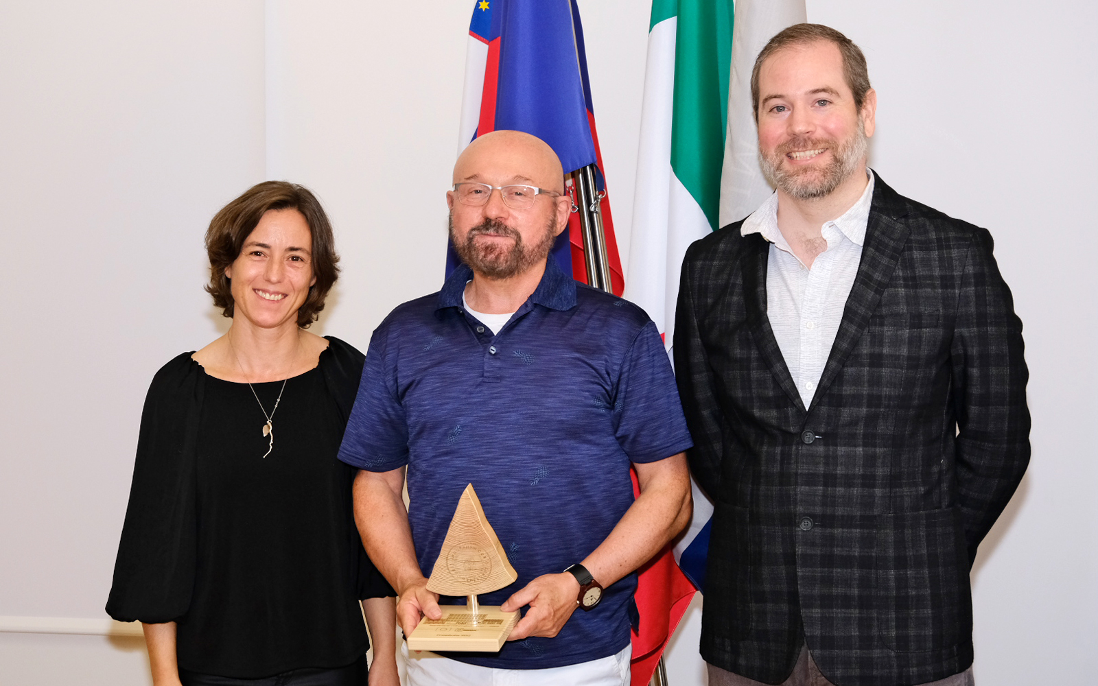 InnoRenew CoE: Celebrating the successful completion of the project phase The photo shows a group of three people.