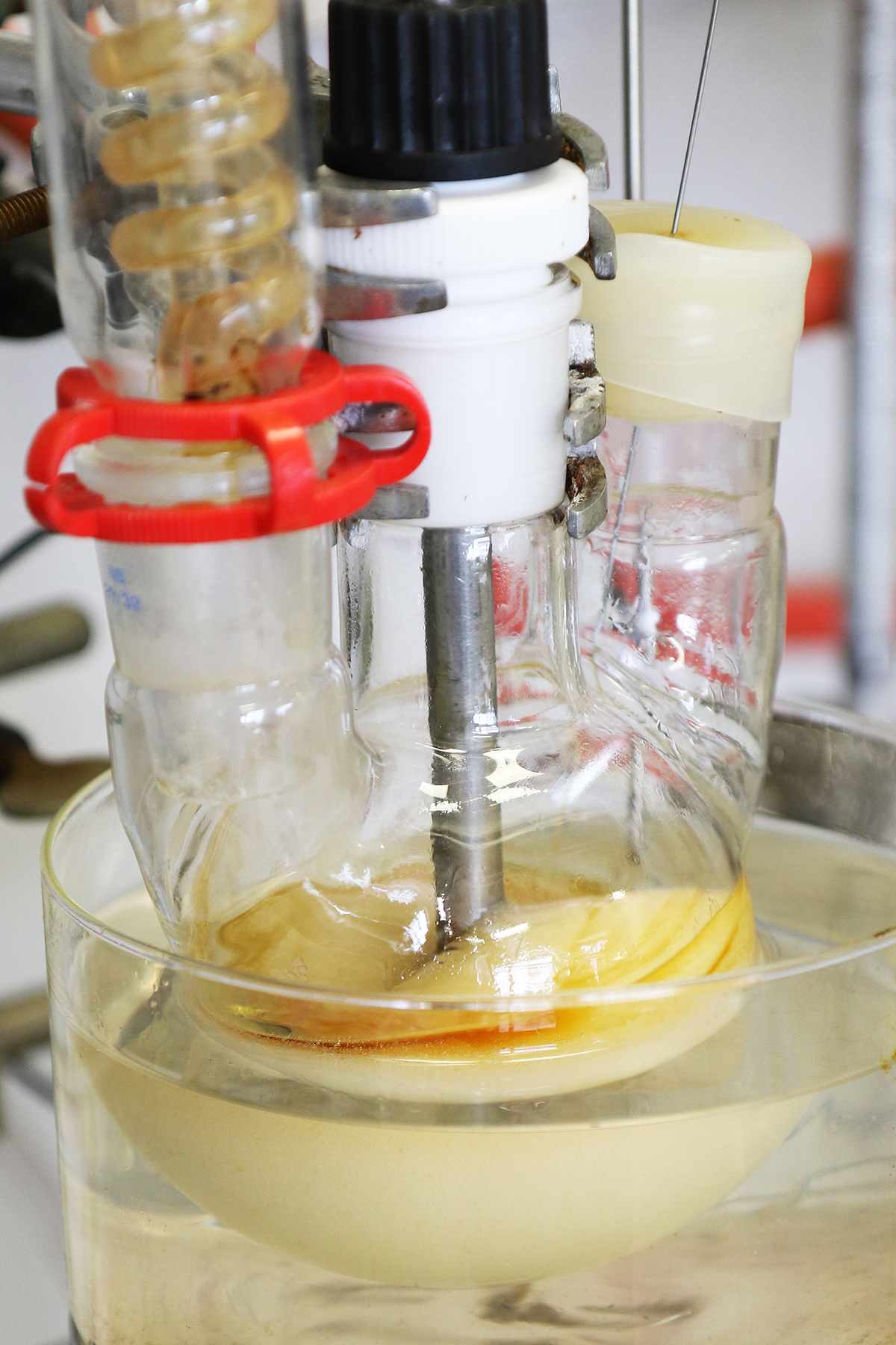 Material with caramel-like color and consistency in a 3-necked flask with reflux condenser and mechanical stirrer. 